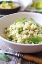 Italian Cuisine. Mock risotto. Stortini pasta with green peas Royalty Free Stock Photo