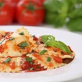 Italian cuisine Pasta Ravioli with tomatoes meal Royalty Free Stock Photo