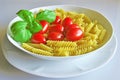 Italian cuisine, pasta with tomato and basil.