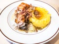 Italian cuisine - Rabbit with polenta on plate