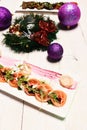 Italian cuisine starters and Christmas wreath on white wooden background