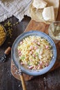 Italian Cuisine. Stortini pasta with fresh ham cubes, grated parmesan cheese and glass of white wine Royalty Free Stock Photo