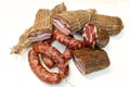 Italian cured products salami sausage bacon loin isolated on white