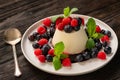 Italian dessert - panna cotta with berries and caramel sauce Royalty Free Stock Photo