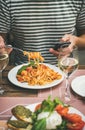 Italian dinner at bistrot with caprese and pasta with shrimps Royalty Free Stock Photo