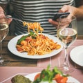 Italian dinner at bistrot with caprese salad and pasta Royalty Free Stock Photo