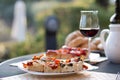 Italian Dinner: Red wine, fresh tasty pizza in the evening, vacation Royalty Free Stock Photo