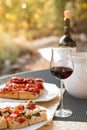 Italian Dinner: Red wine, fresh tasty pizza in the evening, vacation Royalty Free Stock Photo