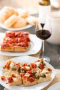 Italian Dinner: Red wine, fresh tasty pizza in the evening, vacation Royalty Free Stock Photo