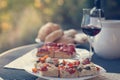 Italian Dinner: Red wine, fresh tasty pizza in the evening, vacation Royalty Free Stock Photo