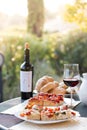 Italian Dinner: Red wine, fresh tasty pizza in the evening, vacation Royalty Free Stock Photo