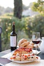 Italian Dinner: Red wine, fresh tasty pizza in the evening, vacation Royalty Free Stock Photo