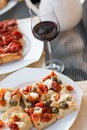 Italian Dinner: Red wine, fresh tasty pizza in the evening, vacation Royalty Free Stock Photo