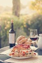 Italian Dinner: Red wine, fresh tasty pizza in the evening, vacation Royalty Free Stock Photo