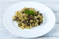 Italian dish Risotto. Garnish dish with mushrooms.