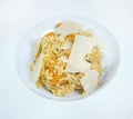 Italian dish risotto with wild white mushrooms and Parmesan cheese in a white plate