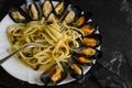 Italian dish with steamed mussels with wine. Close up of spaghetti on a fork. Seafood eating concept. Royalty Free Stock Photo