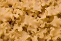 Italian dry pasta of the short mafalda type made with flour. For food background