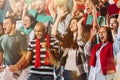 Italian emotive football, soccer fans cheering their team with a red scarfs at stadium. Concept of sport, emotions, team Royalty Free Stock Photo