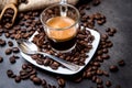 Italian espresso coffee in a glass cup on a black background with coffee beans cutting light Royalty Free Stock Photo