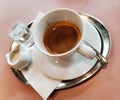Italian espresso with milk and water, served on an iron plate Royalty Free Stock Photo