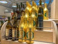 Italian extra virgin olive oil in bottles wrapped in gold foil