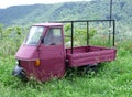 An Italian Farm Truck Left Abandoned In A Field With Tall Grass At Civita Di Bagnoregio, Italy