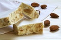 Italian festive torrone or white nougat with almonds, close up Royalty Free Stock Photo