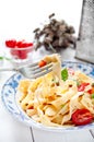 Italian fettuccine pasta with cherry tomatoes and parmesan Royalty Free Stock Photo