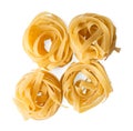 Italian fettuccine or tagliatelle pasta nests isolated on white background. Royalty Free Stock Photo