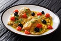 Italian fillet of trout fish with garlic lemon sauce, tomatoes,