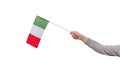 Italian flag in childs hand isolated on white background. Tricolor flag green white red