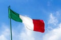 Waving Italian flag against blue sky Royalty Free Stock Photo