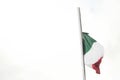 Italian flag flutters in a white landscape and snowy