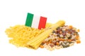 An Italian flag lies on a variety of pasta
