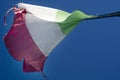 The Italian flag worn by the wind