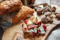 Italian Focaccia bread with cheese and a cheese plate with figs and Gorgonzola, brie, DorBlu and grapes. Royalty Free Stock Photo