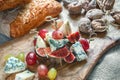 Italian Focaccia bread with cheese and a cheese plate with figs and Gorgonzola, brie, DorBlu and grapes. Royalty Free Stock Photo