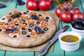 Italian focaccia with tomatoes, black olives and basil Royalty Free Stock Photo