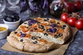 Italian focaccia with tomatoes, black olives and basil Royalty Free Stock Photo