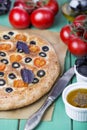 Italian focaccia with tomatoes, black olives and basil Royalty Free Stock Photo