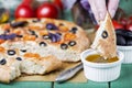 Italian focaccia with tomatoes, black olives and basil Royalty Free Stock Photo