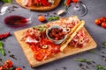 Italian food. Assortment of appetizers for a large company in a restaurant. Different types of smoked meat, sausages and cheeses. Royalty Free Stock Photo