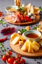 Italian food. Assortment of appetizers for a large company in a restaurant. Different types of smoked meat, sausages and cheeses. Royalty Free Stock Photo