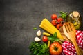 Italian food background on black table. Royalty Free Stock Photo