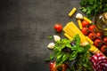 Italian food background on black table. Royalty Free Stock Photo