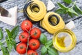 Italian food background with tomatoes, basil, spaghetti, parmesa Royalty Free Stock Photo