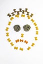 Sad face made with multicolor macaroni Royalty Free Stock Photo