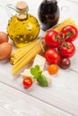 Italian food cooking ingredients. Pasta, tomatoes, basil Royalty Free Stock Photo