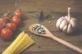 Italian food cooking ingredients. Pasta, vegetables, spices Royalty Free Stock Photo